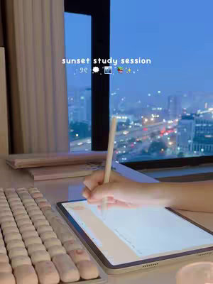 The cover image shows a workspace set up by a window with a night view. A person is writing on an iPad with a stylus. Text at the top of the image reads "sunset study session".