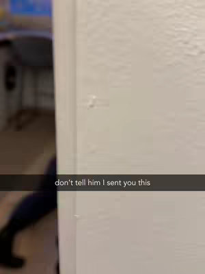 The image shows a section of white wall with a corner to the left. Text overlay sits at the bottom.