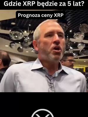 The cover image is a medium shot featuring a middle-aged man with short, graying hair and a beard, set against a blurred background suggesting a conference or event. Above, overlaid text asks, "Gdzie XRP będzie za 5 lat?" (Where will XRP be in 5 years?) with a subheading of "Prognoza ceny XRP" (XRP price forecast). The overall composition is a realistic portrayal, suitable for a financial discussion.