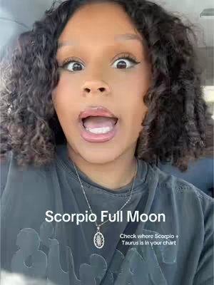 A close-up shot of a woman's face with wide, excited eyes and an open mouth. Text overlays include 'Scorpio Full Moon' and a prompt to check where Scorpio + Taurus is in your chart.