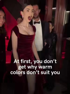 Lily Collins wearing a burgundy dress with a surprised expression. She is standing in a crowded area, with others visible in the background. Text overlay adds context.