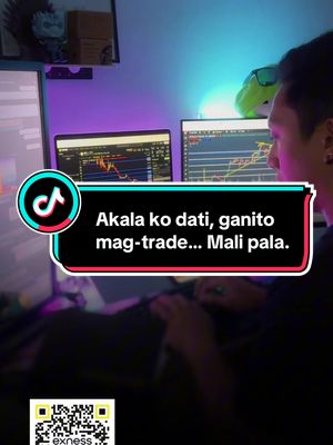 A person is seen from their shoulders up, sitting in front of two computer monitors displaying financial charts. The image has a TikTok logo in the lower left corner, and a text overlay in a speech bubble, indicating the video's message. The setting appears to be a home office or workspace.