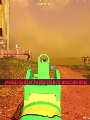 The image is a first-person view from a video game, showing the green sighting of a gun in the foreground. Behind it, in the middle ground, two figures are visible on a grassy patch. In the background, the sky is a gradient from orange to yellow. A red banner at the bottom reads "PRECISION AIRSTRIKE INCOMING".