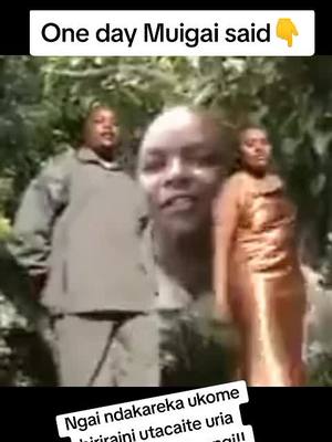 The image shows a selfie-style video frame with three women. The main subject is in the center, with two others on either side. The background is blurry, suggesting an outdoor setting with green foliage. Text overlays the top and bottom of the frame.