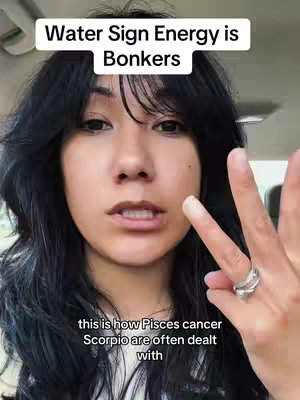The image shows a close-up of a person with black hair in a car, pointing at the camera with a peace sign. Text appears across the top, with a second block of text at the bottom.