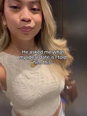 A young woman in a white top is smiling and looking towards the camera. The background seems to be an elevator or a similar enclosed space. Text overlay is placed at the bottom part of the image.