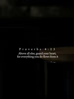 A dark image with a portion of a wooden table visible on the right. Text is centered, reading 'Proverbs 4:23' followed by a quote.