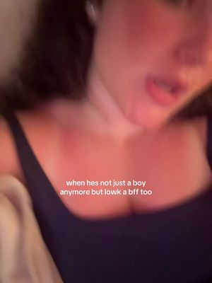 A cropped selfie shows a person's upper body, close to their neck and chest, with a low-cut top. The person's face is partially visible, with their mouth open, and a faint blush on their cheeks. Bruise-like red marks are visible on the person's collarbone and neck area. Overlay text is added near the bottom of the image.