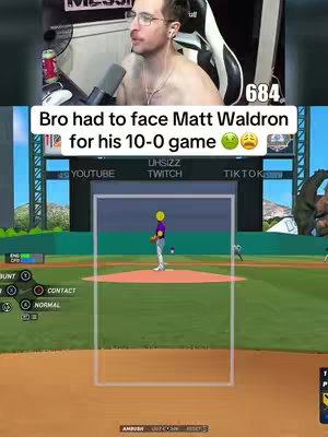 The cover image is a vertical, split-screen view. The top half shows a person, presumably the content creator, appearing shirtless from the waist up, wearing glasses, and headphones. Below the person's image is the game interface showing a baseball field, a baseball player in a purple uniform, and the game's controls and user interface elements.