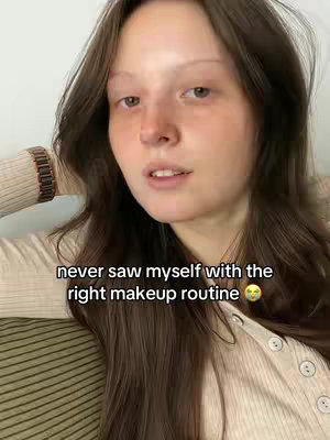 The cover image features a close-up of a young woman with fair skin and long, brown hair, looking directly at the camera, her expression neutral. The background is out of focus showing a section of a patterned surface. Text overlay in white font placed near the bottom of the image.