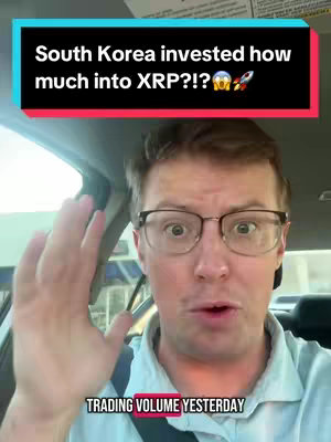A man with glasses speaking while sitting in a car. There is a text overlay in the top of the image and at the bottom, as well.
