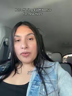 A woman with dark hair and a denim jacket is sitting in a car, looking at the camera. Text at the top reads, "ICE offering $50K bonus for new hires".