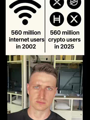 The cover image features a side-by-side comparison presented vertically. The left side shows an antenna symbol above "560 million internet users in 2002." The right side features a series of cryptocurrency symbols above "560 million crypto users in 2025." Below, the creator is centered, facing the camera. He has short, light brown hair and is wearing a black shirt. The background is a room with light-colored walls and what appears to be a TV or monitor placed in a cubby.