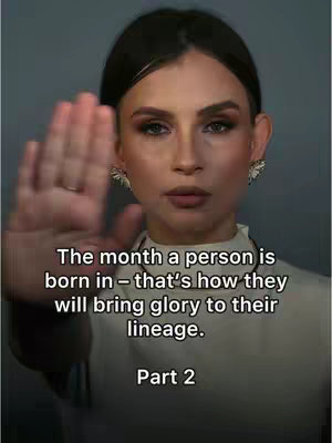 A woman with dark hair and makeup, facing the camera with her right hand up. The image has text overlayed at the bottom.