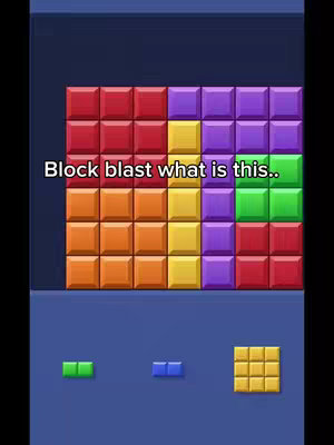 The image shows a mobile game screen featuring a grid of colorful blocks, with smaller block configurations below, and the overlay text is in a white font.