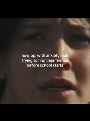 A close-up shot of a person's face, likely a young woman, with a slightly blurred background. The person has dark hair and is looking down and to the side with a facial expression portraying anxiety. Text overlayed on the image reads, "how ppl with anxiety look trying to find their friends before school starts."