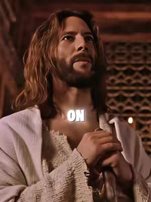 The cover image depicts a medium shot of a man with long, wavy brown hair and a beard, dressed in a white robe. The man is looking upwards, appearing to be in contemplation or prayer. The word "ON" is superimposed on his chest in a bold white font. The lighting suggests an indoor setting, with soft, warm tones enhancing the overall sacred and spiritual atmosphere.