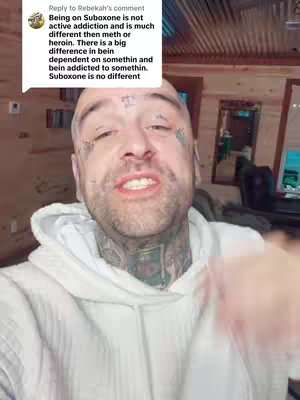 The cover image is a selfie of a man with numerous face tattoos and a white hoodie. He is speaking and gesturing. A comment thread is present in a white box in the upper left of the image, with text in black font