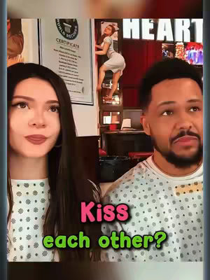 The image shows a split screen with a woman on the left, and a man on the right. In the background is a scene of a woman climbing a ladder inside what appears to be a bar. Text overlays read "Kiss each other?" in a pink and green color.