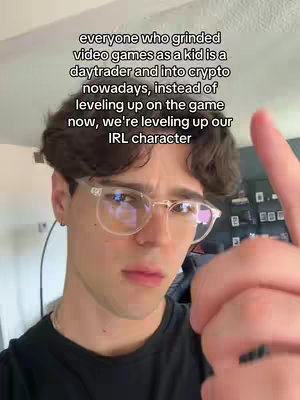 A young man with short dark hair and glasses looks at the camera with a serious expression. The background is a blurred room. Text overlays are added to the image.