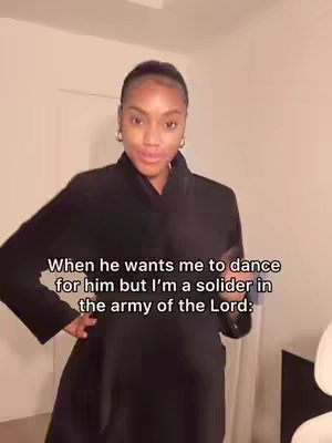 A woman wearing a dark coat stands in a room with a neutral background, looking directly at the camera. Text overlayed on the image conveys the message of the video.