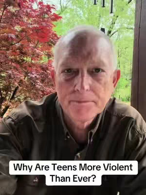 A man with short white hair and a serious expression is the central focus. Behind him is a blurred background featuring red-leafed trees and greenery, suggesting an outdoor setting. The video overlay text reads, 'Why Are Teens More Violent Than Ever?' in a white font against a black rectangular background.