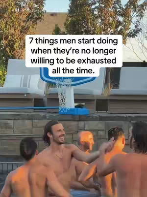 A group of shirtless men are in a pool area, with a basketball hoop visible behind them and text overlayed on the image describing things men start doing when they're no longer willing to be exhausted.