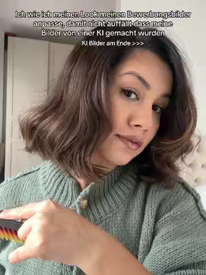 A woman with brown, wavy hair is centered in a selfie-style shot. She wears a green sweater and is holding a comb with her left hand. The background is a light-colored room. Text overlays the image.