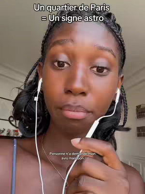 A close-up shot features a young woman with dark skin and braided hair, wearing white earphones. She is positioned centrally in the frame, looking directly at the camera with a neutral expression. The background is blurred, with a hint of a window and light-colored walls. Text overlays are visible at the top and bottom of the image.