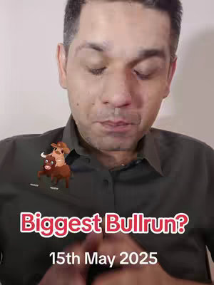 A close-up shot of a man against a plain background, with text and a cartoon image overlayed. The man has short, dark hair and is wearing a dark green buttoned shirt. He is looking down with a slightly contemplative expression. Above his shoulder is a cartoon image of a person riding a bull; below him is text.