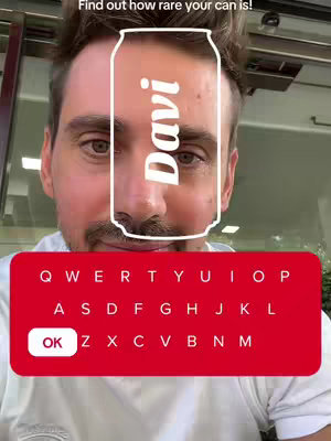 A selfie-style image with a man at the center framed from the chest up. The background appears to be a public outdoor space with a metal overhead screen. A white outline of a soda can is superimposed over the man's face, partially obscuring his facial features. The text 'Davi' is vertically written on the can's surface.
