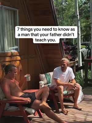 Two men are seated outdoors, one is shirtless, holding a mug and the other is wearing a white t-shirt. Above them in a white rectangle is the text: "7 things you need to know as a man that your father didn't teach you."