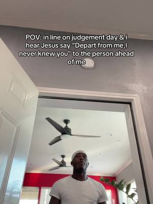 An individual looks up from the bottom center, framed by a doorway and a ceiling with a fan, suggesting a personal space or an interior shot. The person wears a white t-shirt and cap. Above, text overlayed on a light grey ceiling reads "POV: in line on judgement day & i hear Jesus say 'Depart from me, I never knew you' to the person ahead of me".