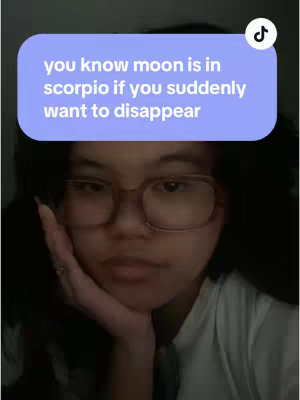 A selfie with the creator, a woman, in the forefront. A purple overlaid text box in the upper-middle section displays text in white font. The creator gazes at the camera, resting her chin on her hand. She wears glasses and a white shirt.