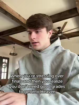 A young man in a gray hoodie is the focus, looking surprised. Text overlays the bottom, matching the video's theme against a background of a ceiling with wooden beams and a ceiling fan.