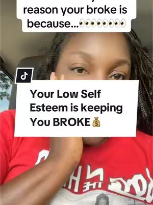 A selfie-style video cover image featuring a Black woman in a red shirt. She is positioned in what appears a car. A text overlay states "Your Low Self Esteem is keeping You BROKE 💰".