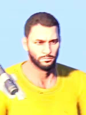 The cover image is a medium shot of a man's face and upper chest. The man has dark hair and a short beard. He is wearing a yellow shirt. The man's expression is serious. A partially visible object, possibly a weapon, is visible on the left side of the frame.