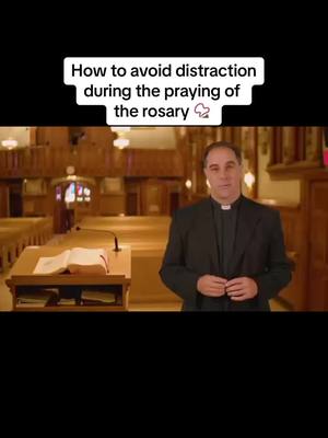 A man in a black suit and clerical collar stands and looks towards the camera against the backdrop of an empty church. The hook says: "How to avoid distraction during the praying of the rosary".