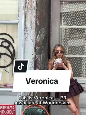 The image shows a young woman wearing sunglasses and holding a sandwich outside a building. A TikTok logo is present in the bottom left corner. Text overlays identify the woman as "Veronica," and detail her job title. The background suggests an urban setting.