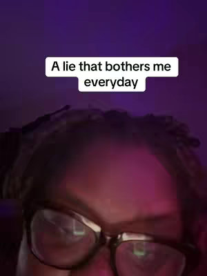 The image features a close-up shot of a person's face, possibly a woman, with the focus on their eyes and the upper part of their face. They are wearing glasses. Above them is a white rectangular box with the text overlay, ‘A lie that bothers me everyday’ . The overall color scheme appears to be dark with a pinkish purple ambient lighting.