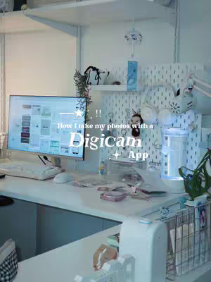 The cover image displays a well-lit desk with a monitor showing an app interface. The scene has a clean, organized aesthetic, with various items such as notebooks, a keyboard, and decorations on the shelves and walls. Text overlays are added to the image.
