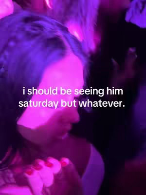 A close-up shot of a person's face, mostly in profile. The image is bathed in purple and pink neon lighting. Text is overlaid on the image.