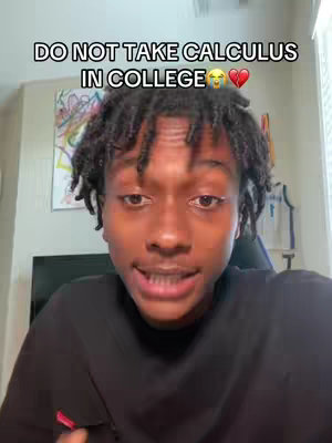 A young man with dark skin and dreadlocks is centered in the frame, looking directly at the camera. Above him, a text overlay reads: 'DO NOT TAKE CALCULUS IN COLLEGE' followed by a laughing emoji and a heart emoji. The background is a blurred room setting, partially visible behind the man, suggesting an indoor filming location.