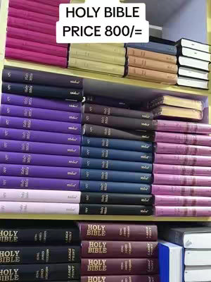 A shelf filled with various colorful Bibles is presented. The spines of the books are visible, arranged in neat rows. A text overlay at the top indicates the product's name and price.