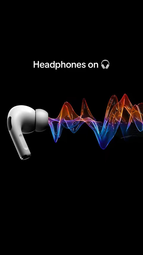 A white earbud is on the left, with a waveform extending toward the right. The waveform transitions from shades of blue to orange. The background is black, with the text "Headphones on" in white.