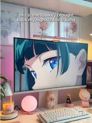 The cover image shows a close-up of an anime character's eyes on a computer monitor. The monitor is on a desk with various decorative items like a pink lamp, a small figurine, and a candle. Text overlays the image, discussing the emotional impact of a scene.