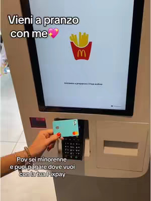 A woman's hand holding a teal credit card in front of a McDonald's kiosk screen. The screen shows the McDonald's logo with fries. Text overlays are at the top and bottom of the image.