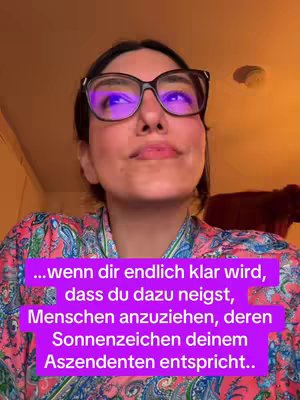 The cover image shows a woman with glasses looking upwards in a room. A text overlay in a purple box provides a key astrology tip about relationships. The background is a warm color with some objects visible.