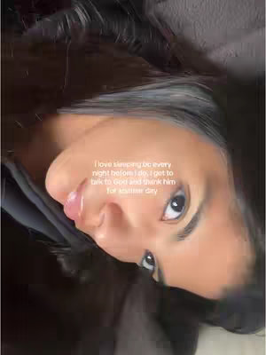 The image features a close-up shot of a person's face. The person is looking towards the camera. The background is darker and out of focus, which highlights the face. The image has text overlayed on it.