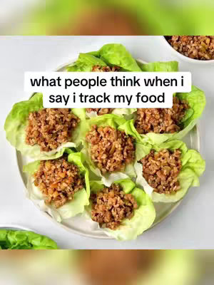 An overhead shot showcases a plate of lettuce cups filled with a savory brown mixture. The food is arranged on a white plate, and text overlays the image.